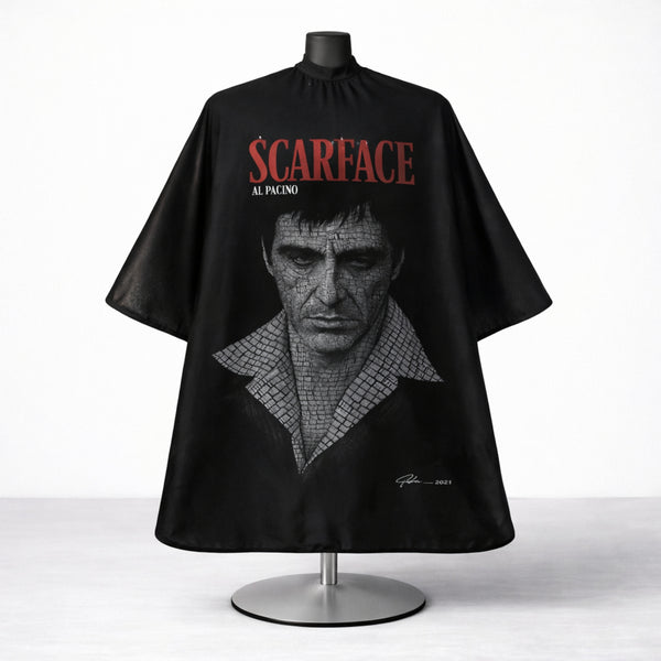 Professional Scarface barber cape used for haircuts and grooming in barbershops.